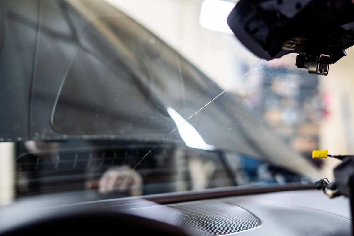 Driver's view through a cracked windshield before repair